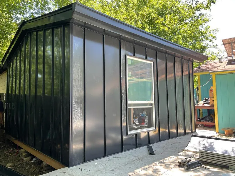 Black standing seam metal wall panels for Metal Roof Installation in Chubbuck